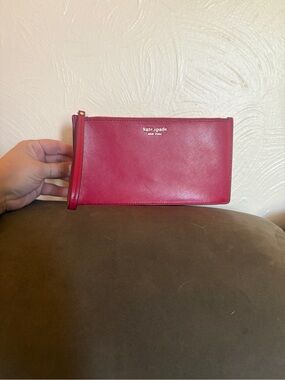 Kate Spade pink-red Saviano Leather Wristlet with Gold Logo